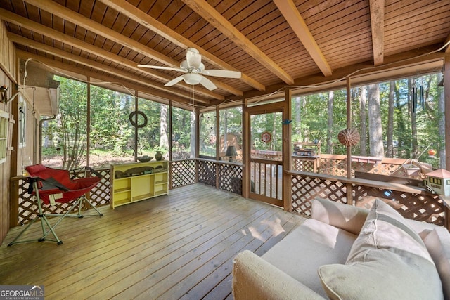 sunroom / solarium with ceiling fan, beamed ceiling, and wooden ceiling