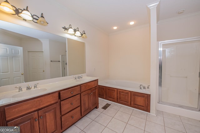 bathroom with ornate columns, tile patterned floors, ornamental molding, shower with separate bathtub, and vanity