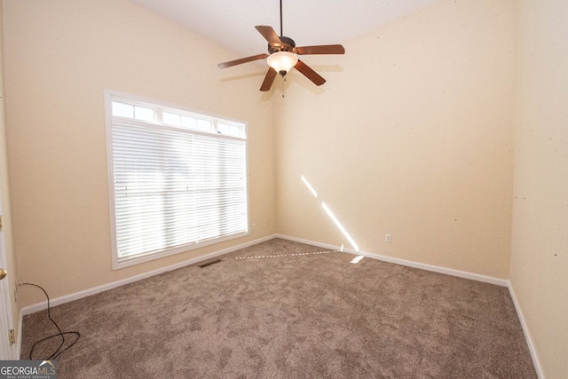 carpeted empty room featuring ceiling fan