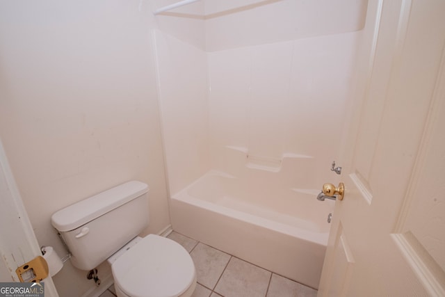 bathroom featuring bathtub / shower combination, tile patterned floors, and toilet