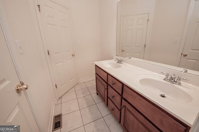 bathroom with tile patterned flooring and vanity