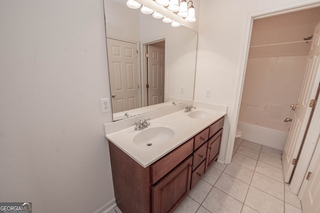 full bathroom with tile patterned floors, toilet, vanity, and  shower combination