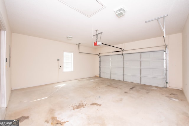 garage featuring a garage door opener