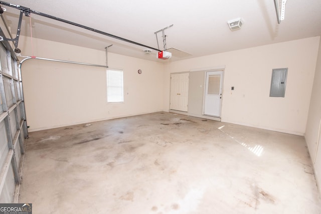 garage featuring electric panel and a garage door opener