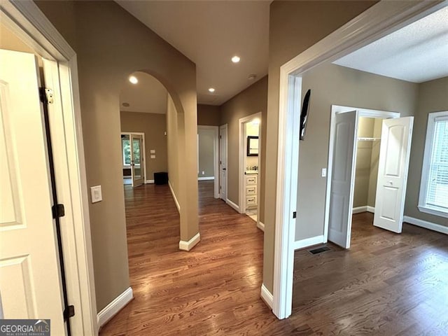 hall with dark hardwood / wood-style floors