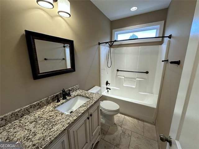 full bathroom featuring tub / shower combination, vanity, and toilet