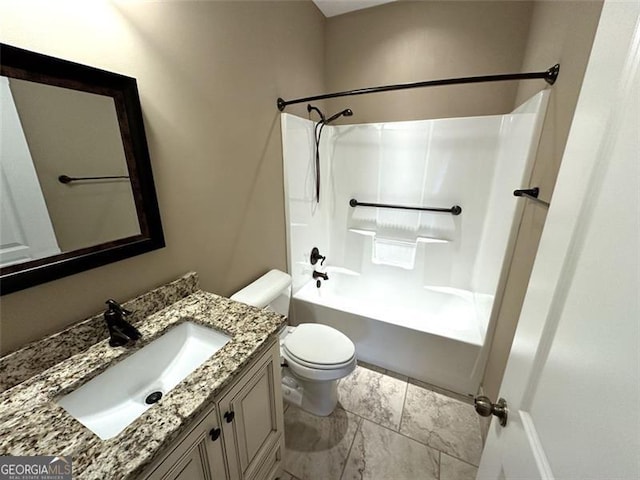 full bathroom with  shower combination, vanity, and toilet