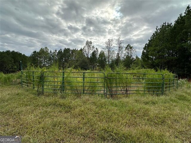 view of gate featuring a rural view