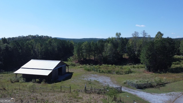 birds eye view of property featuring a rural view