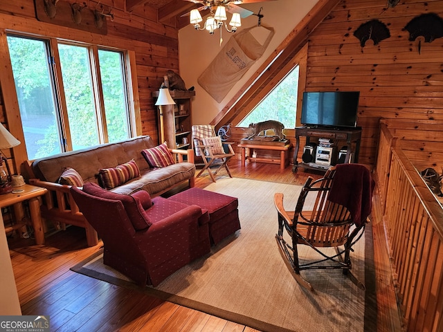 living room featuring wooden walls and wood-type flooring