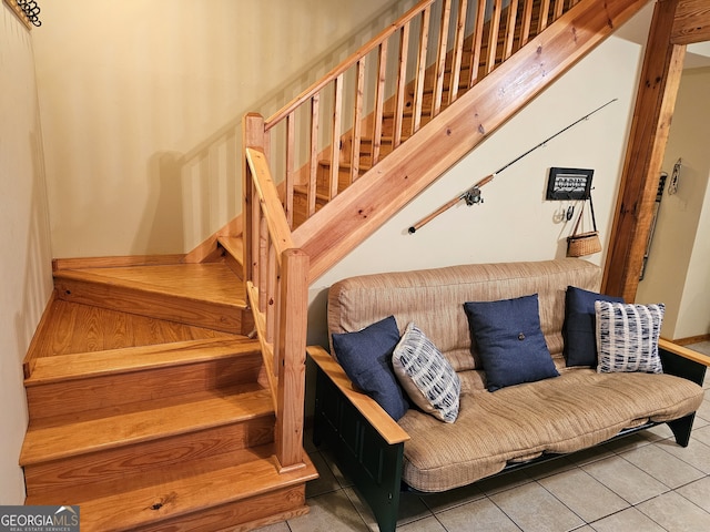 stairway featuring tile patterned flooring