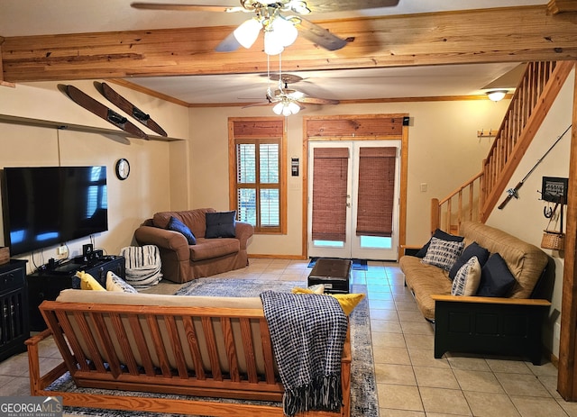 tiled living room with ceiling fan, french doors, and ornamental molding