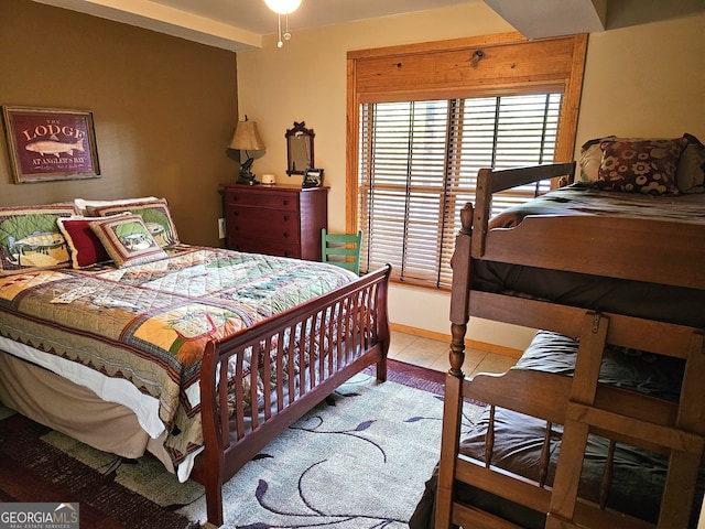 bedroom featuring light tile patterned flooring