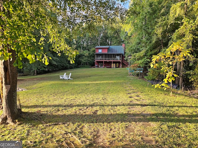 view of yard featuring a wooden deck