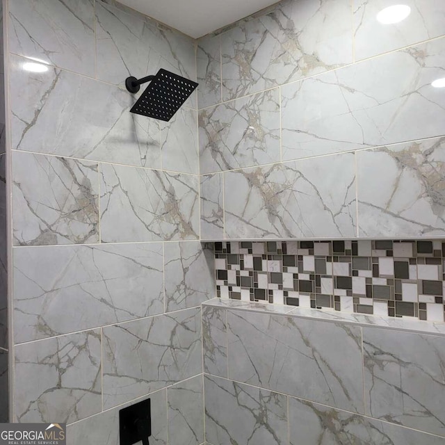 details featuring a tile shower