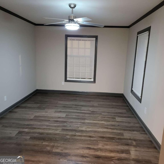 empty room with ornamental molding, dark hardwood / wood-style floors, and ceiling fan