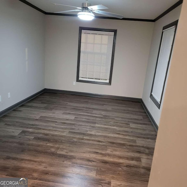 spare room with ornamental molding, dark hardwood / wood-style floors, and ceiling fan