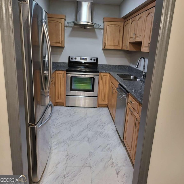 kitchen with island range hood, stainless steel appliances, sink, and dark stone countertops