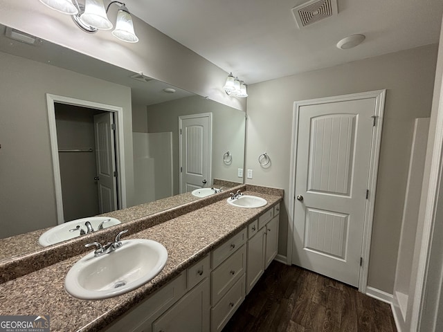 bathroom with wood-type flooring and vanity