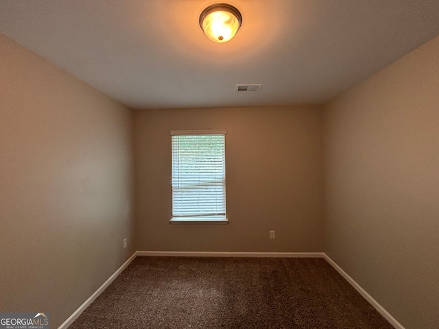 empty room with carpet flooring