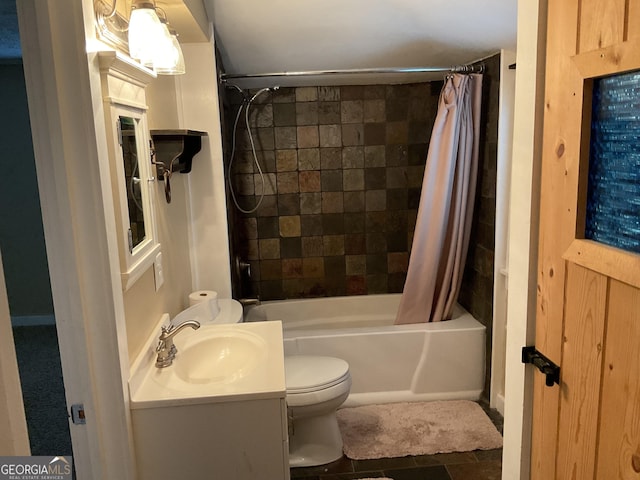 full bathroom featuring vanity, shower / tub combo, and toilet