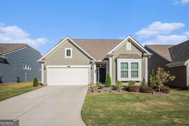 view of front of home featuring a garage and a front yard