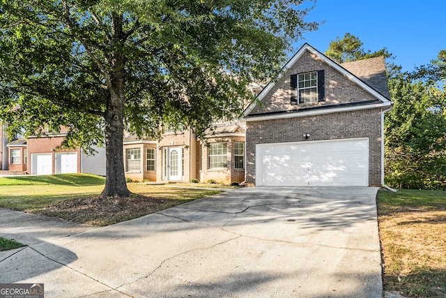 view of front of home with a garage and a front lawn