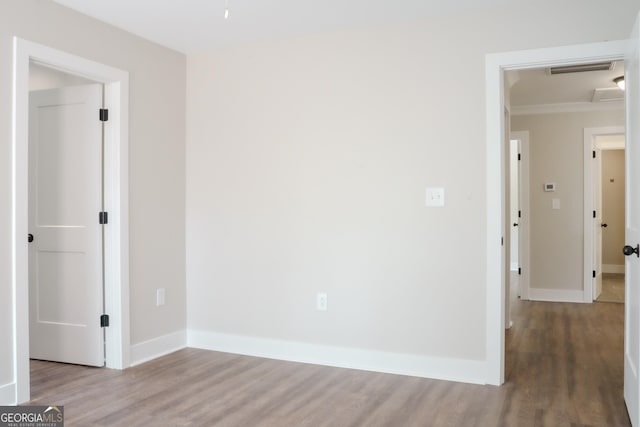 unfurnished room featuring hardwood / wood-style floors