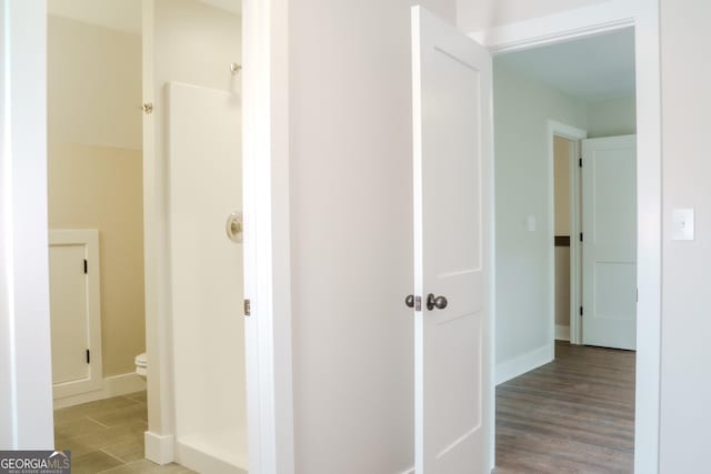 corridor featuring wood-type flooring