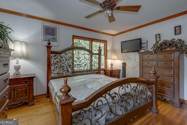 bedroom with ornamental molding, light hardwood / wood-style floors, and ceiling fan