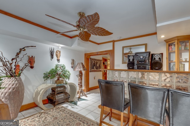 interior space featuring ceiling fan, ornamental molding, and light tile patterned floors