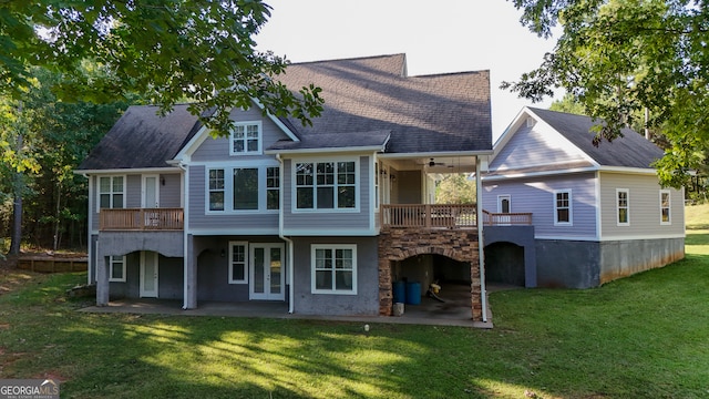 back of house with a patio area and a yard