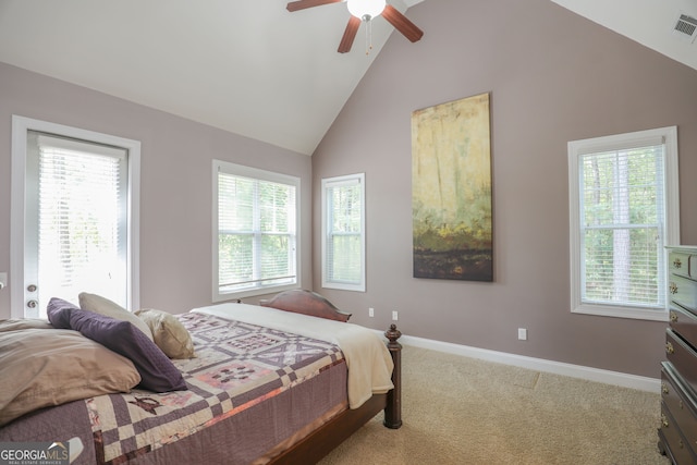 carpeted bedroom with multiple windows, high vaulted ceiling, and ceiling fan