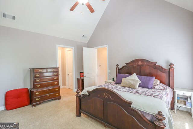 carpeted bedroom with high vaulted ceiling and ceiling fan