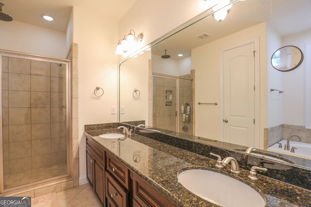 bathroom with vanity, shower with separate bathtub, and tile patterned floors