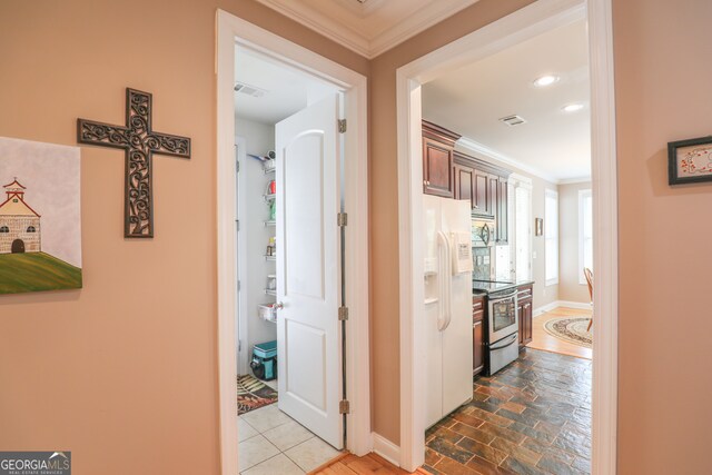 corridor featuring crown molding