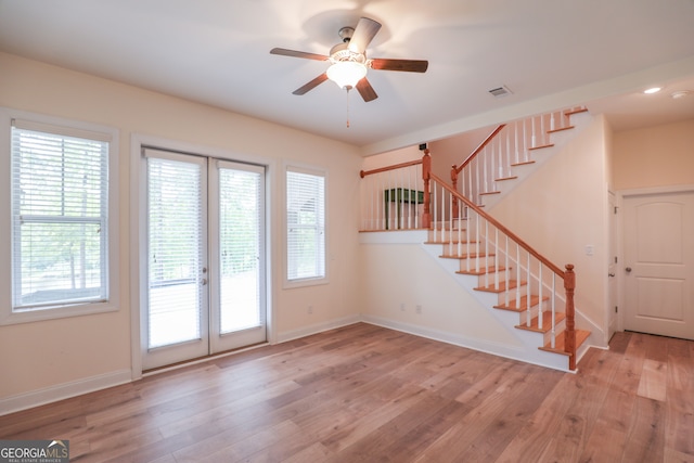 entryway with french doors, light hardwood / wood-style flooring, and ceiling fan