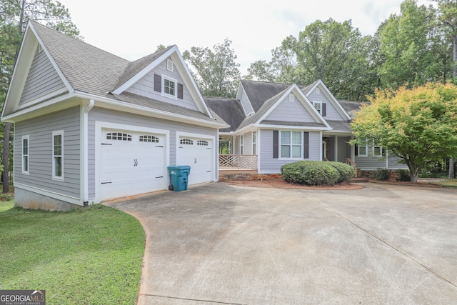 view of front of house with a garage and a front lawn