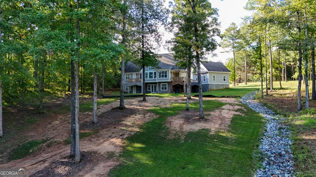 view of yard featuring a wooden deck