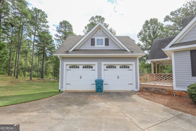 garage featuring a yard