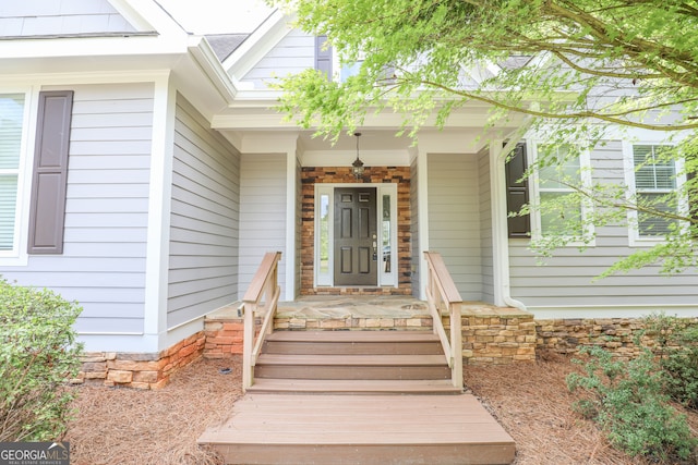 doorway to property featuring covered porch