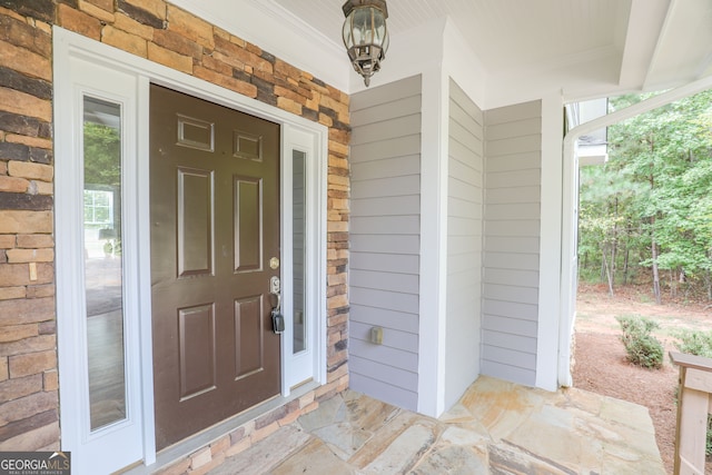 doorway to property featuring a porch