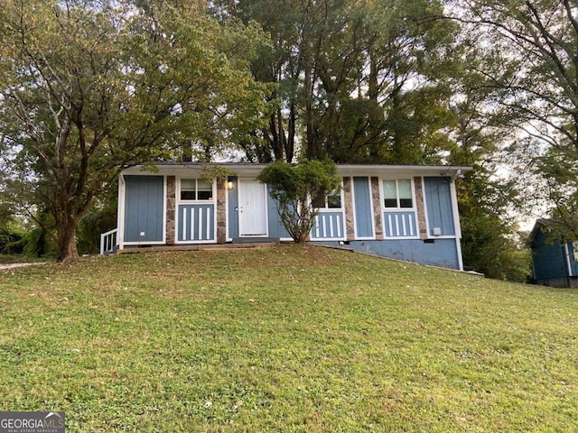 4649 Big Valley Ct, Stone Mountain, GA 30083 - view of front of house featuring a front lawn and board and batten siding