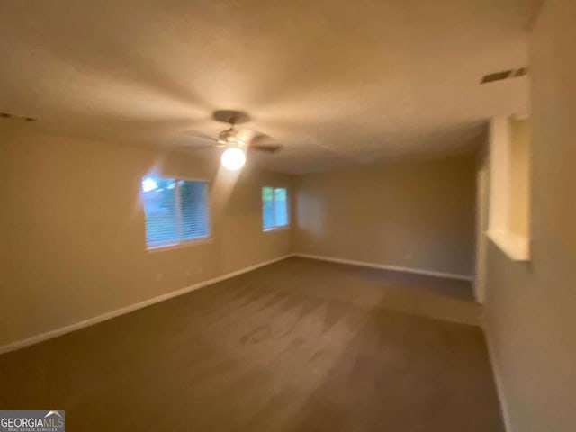 4649 Big Valley Ct, Stone Mountain, GA 30083 - empty room featuring carpet flooring, ceiling fan, and baseboards