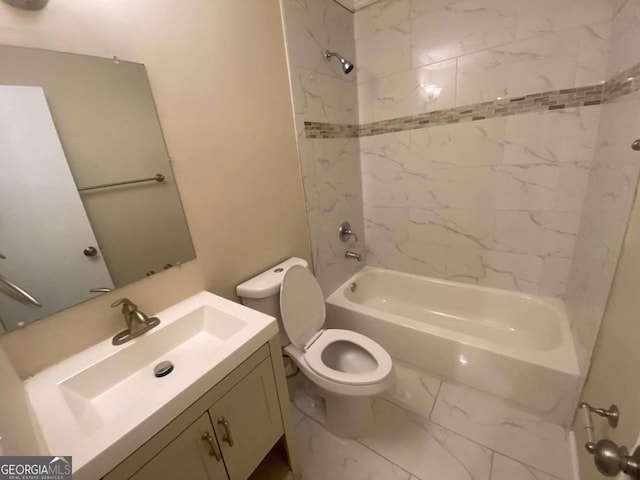 full bathroom featuring vanity, tiled shower / bath, and toilet