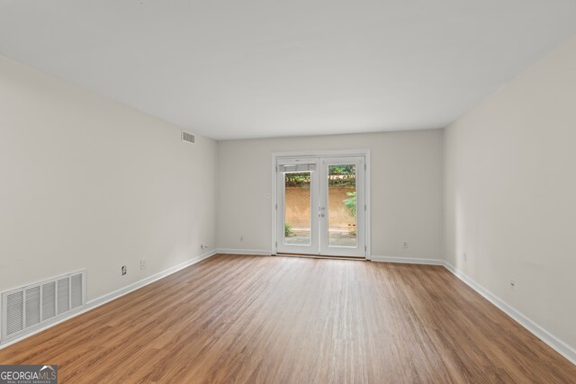 spare room featuring light wood-type flooring