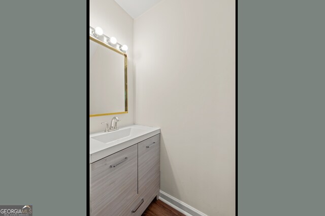 bathroom with wood-type flooring and vanity