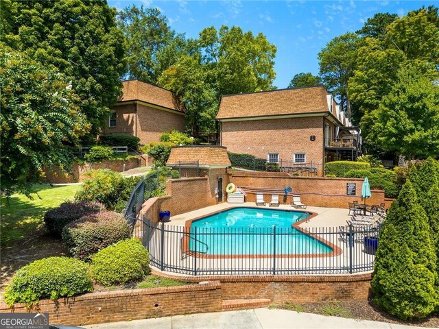 view of pool featuring a patio area