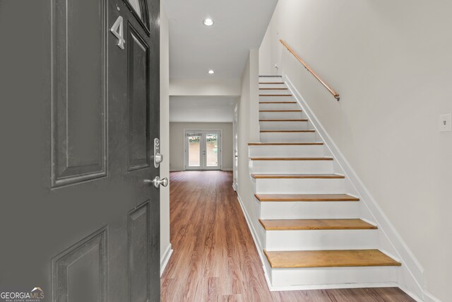 entrance foyer featuring french doors and light wood-type flooring