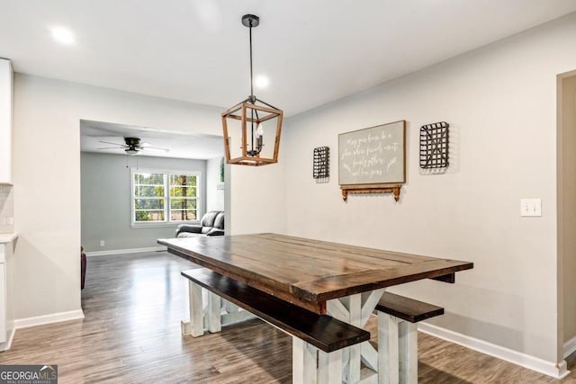 dining room with ceiling fan and hardwood / wood-style floors